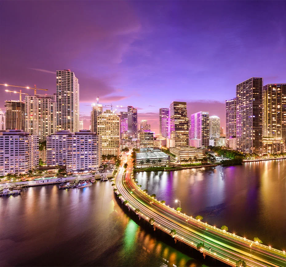 View of Miami from under the bridge connecting to Miami Beach, seen from the water.